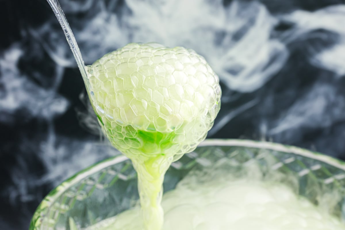 bubbling green punch in ladle