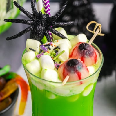 close up of marshmallows and gummies in cup of witches brew