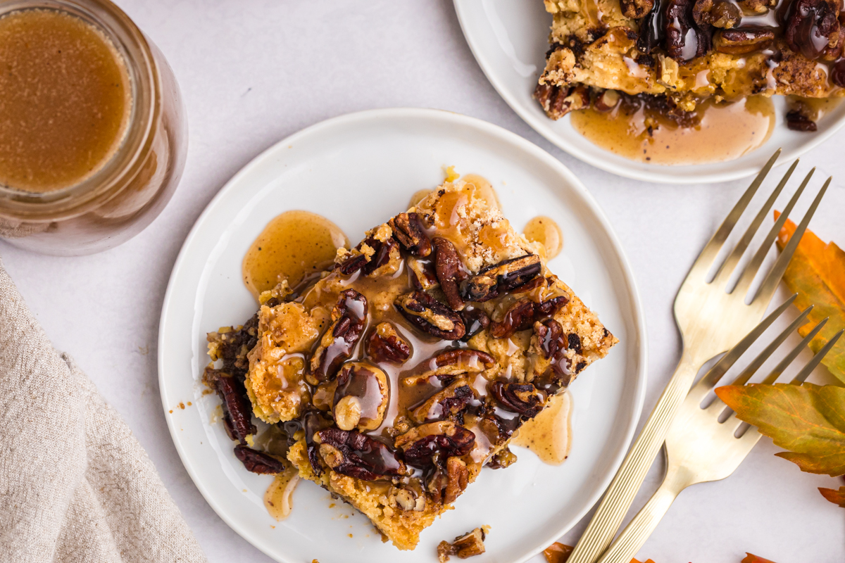overhead shot of pecan bar topped with apple cider caramel sauce