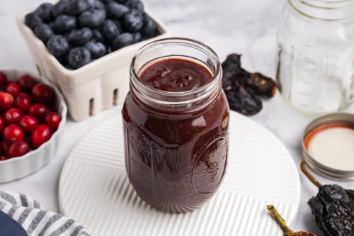angled shot of jar of cranberry bbq sauce