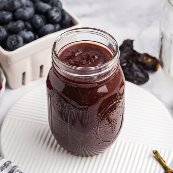 angled shot of jar of cranberry bbq sauce