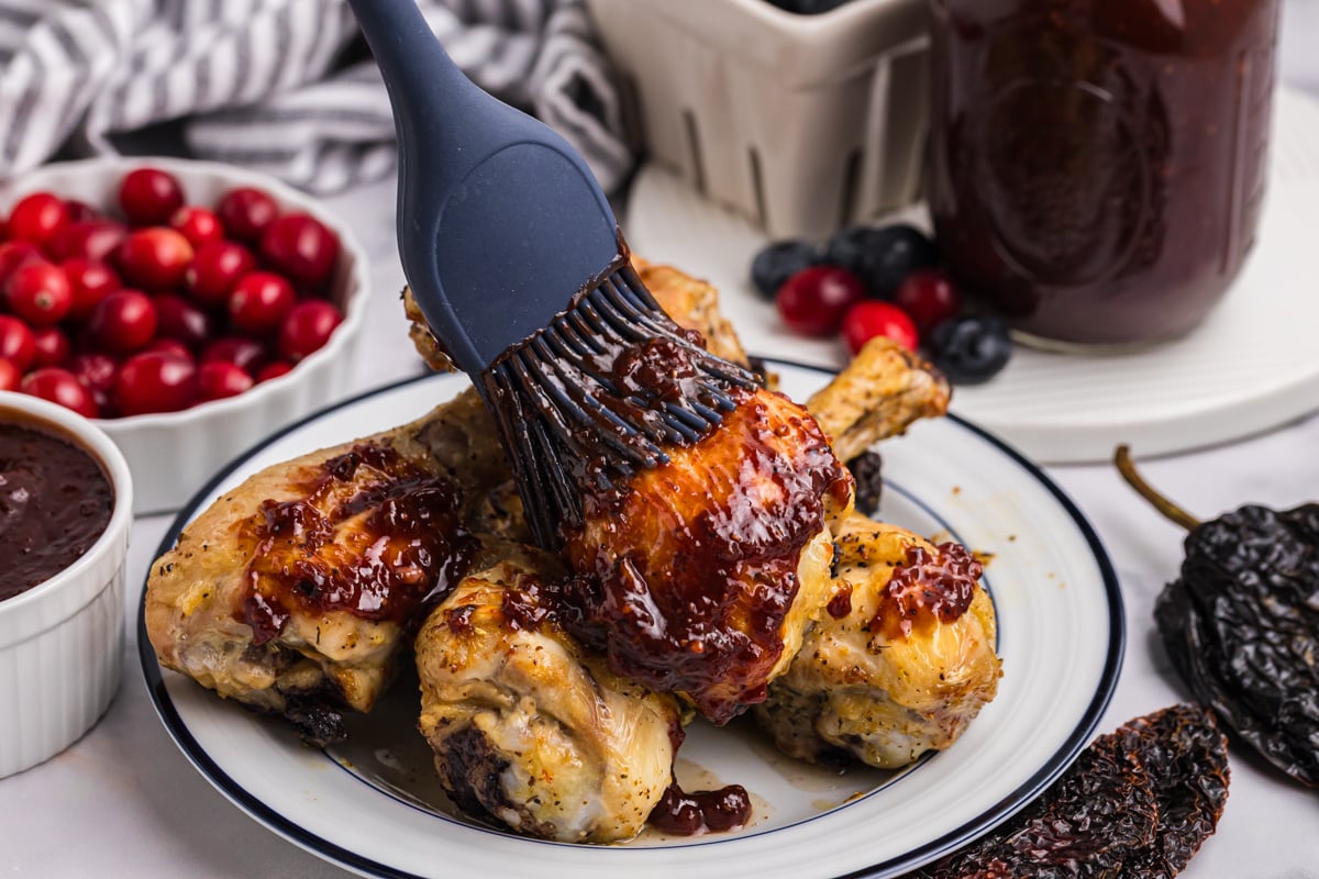 cranberry bbq sauce brushed onto chicken legs
