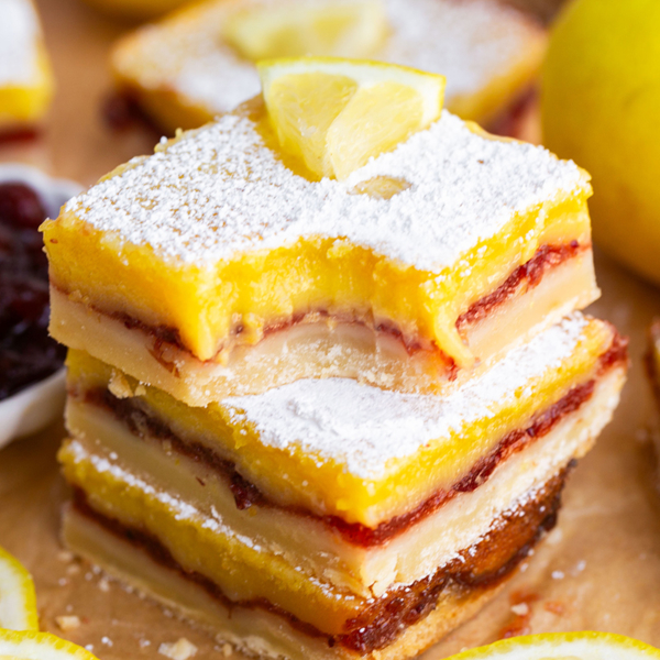 bite taken out of stack of lemon cranberry bars