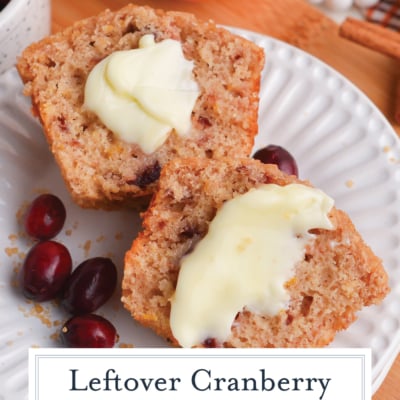 cranberry sauce muffin cut in half and topped with butter on plate