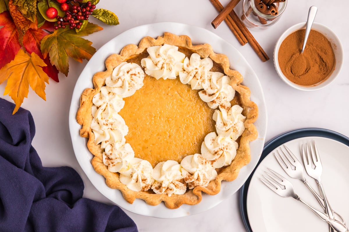 overhead shot of maple cream pie topped with whipped cream