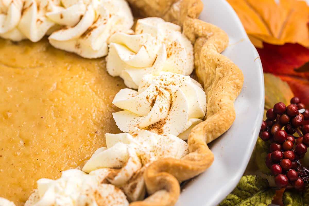 close up shot of whipped cream on maple cream pie