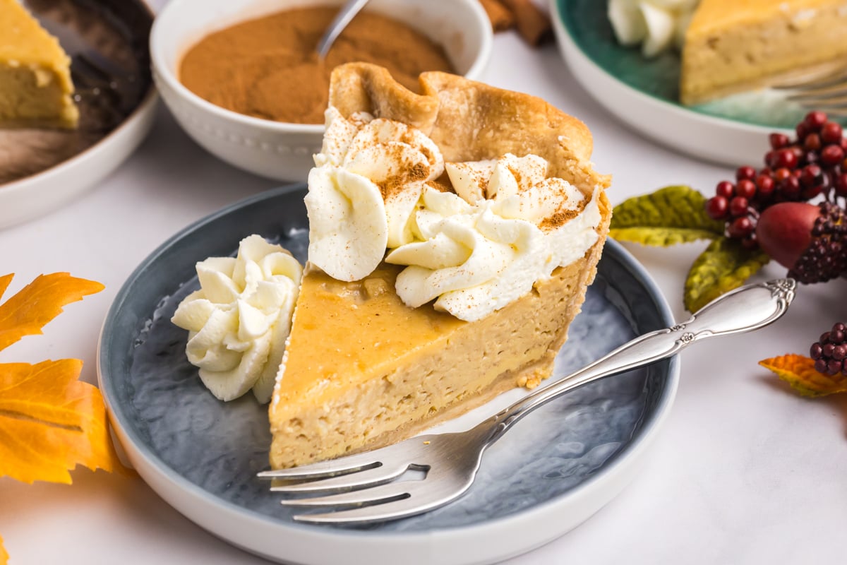 angled shot of slice of maple cream pie on plate with fork