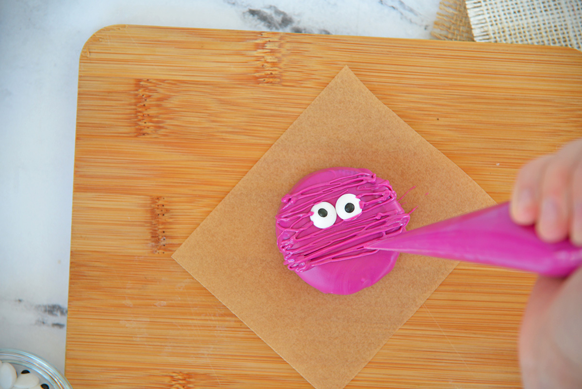 piping mummy wrap with melted chocolate