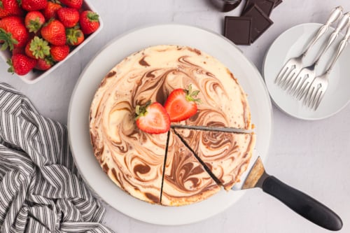 overhead shot of sliced marble cheesecake