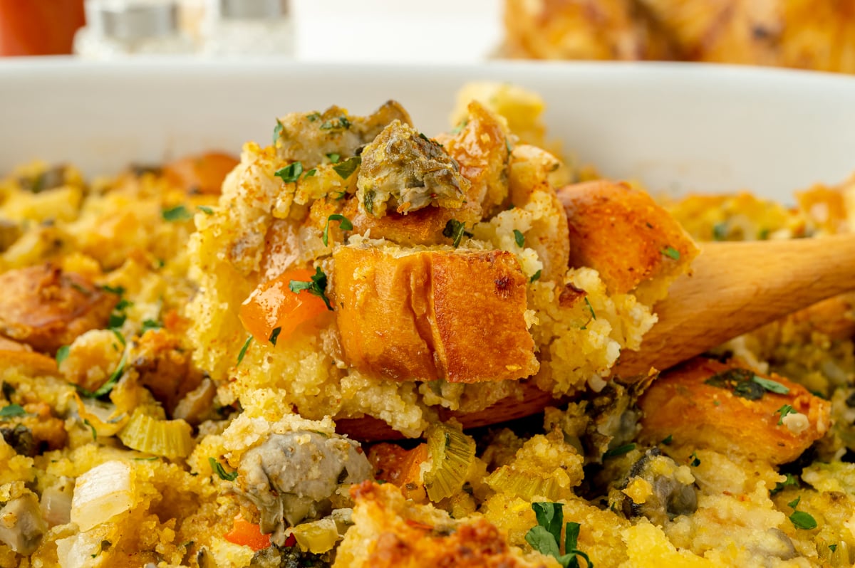 straight on shot of oyster stuffing on wooden spoon
