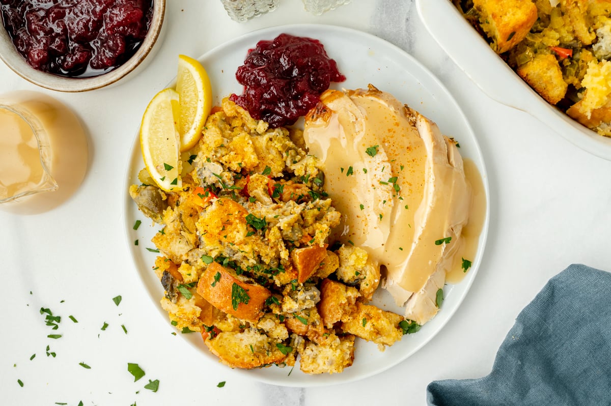 overhead shot of turkey, stuffing and cranberry sauce on plate