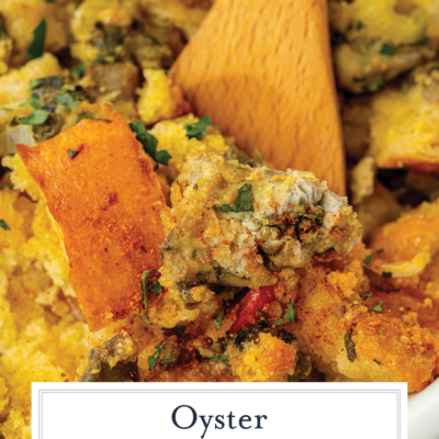 wooden spoon in pan of oyster dressing with text overlay