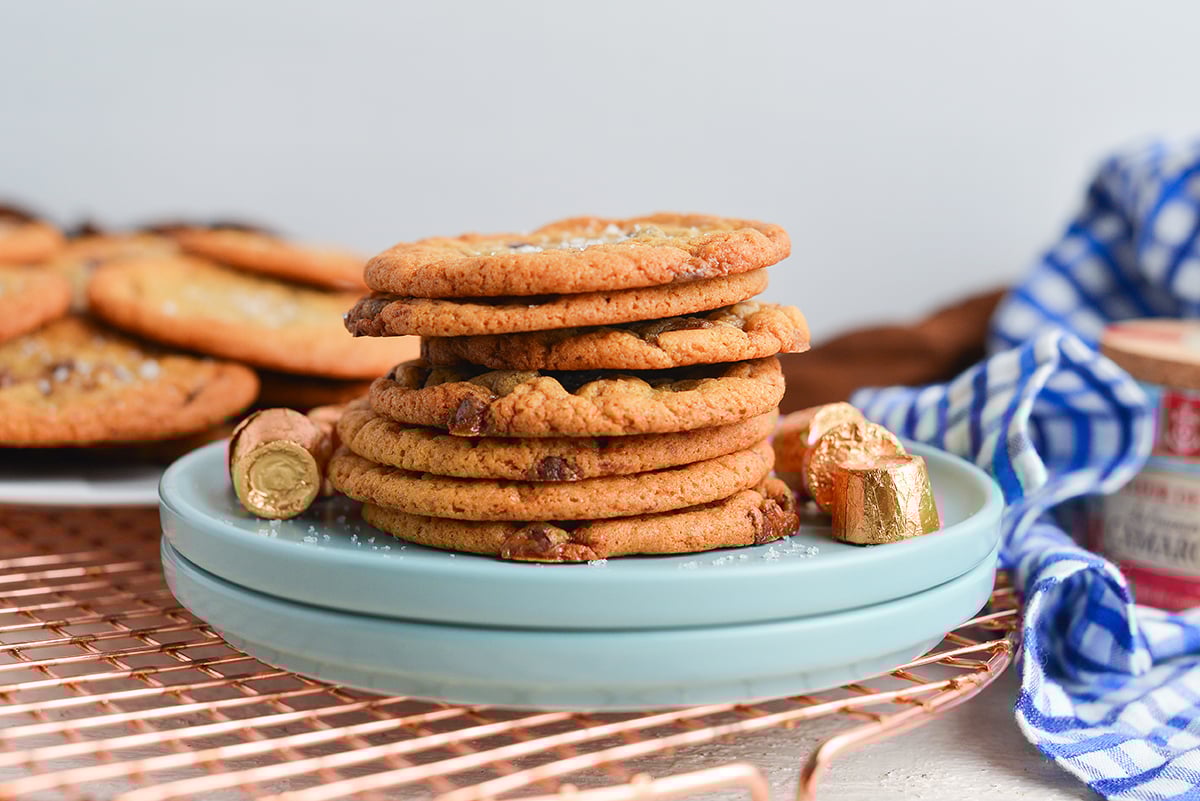 straight on shot of stack of rolo sugar cookies on blue plate