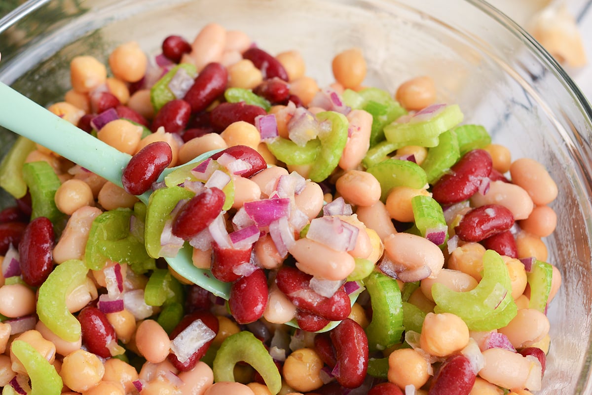 spatula in bowl of bean salad