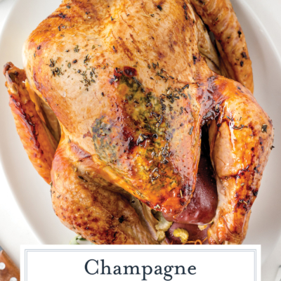 overhead shot of champagne turkey on platter with text overlay
