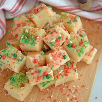 Pile of Christmas fudge on a wood cutting board