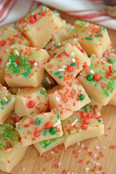 Pile of Christmas fudge on a wood cutting board