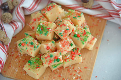 Pile of Christmas fudge on a wood cutting board