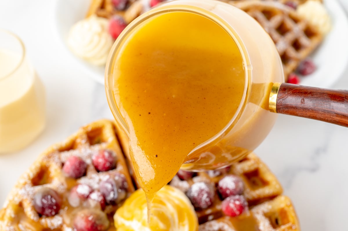 eggnog syrup pouring onto waffles
