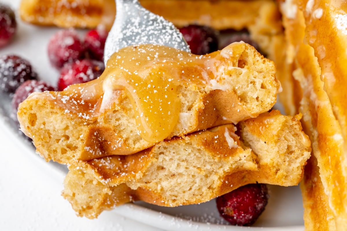 close up of cite of waffle with syrup