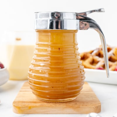 jar of eggnog syrup on cutting board