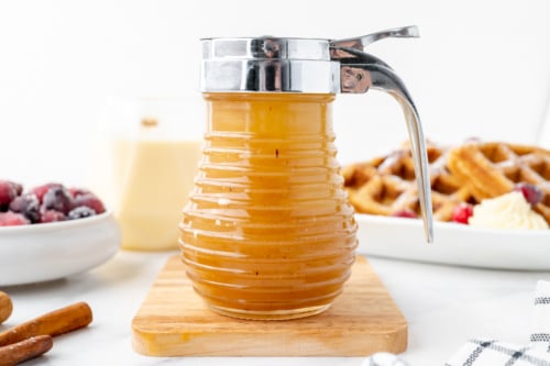 jar of eggnog syrup on cutting board