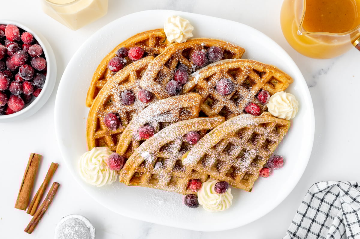 overhead shot of platter of triangles of eggnog waffles