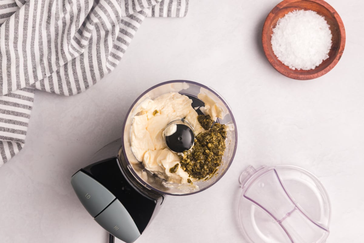 overhead shot of aioli ingredients in food processor