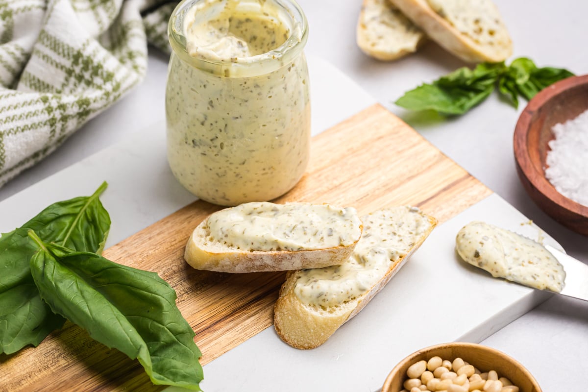two slices of bread slathered with pesto aioli