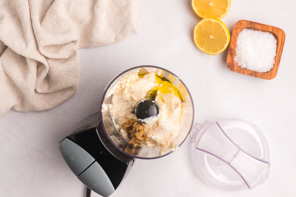 overhead shot of aioli ingredients in food processor