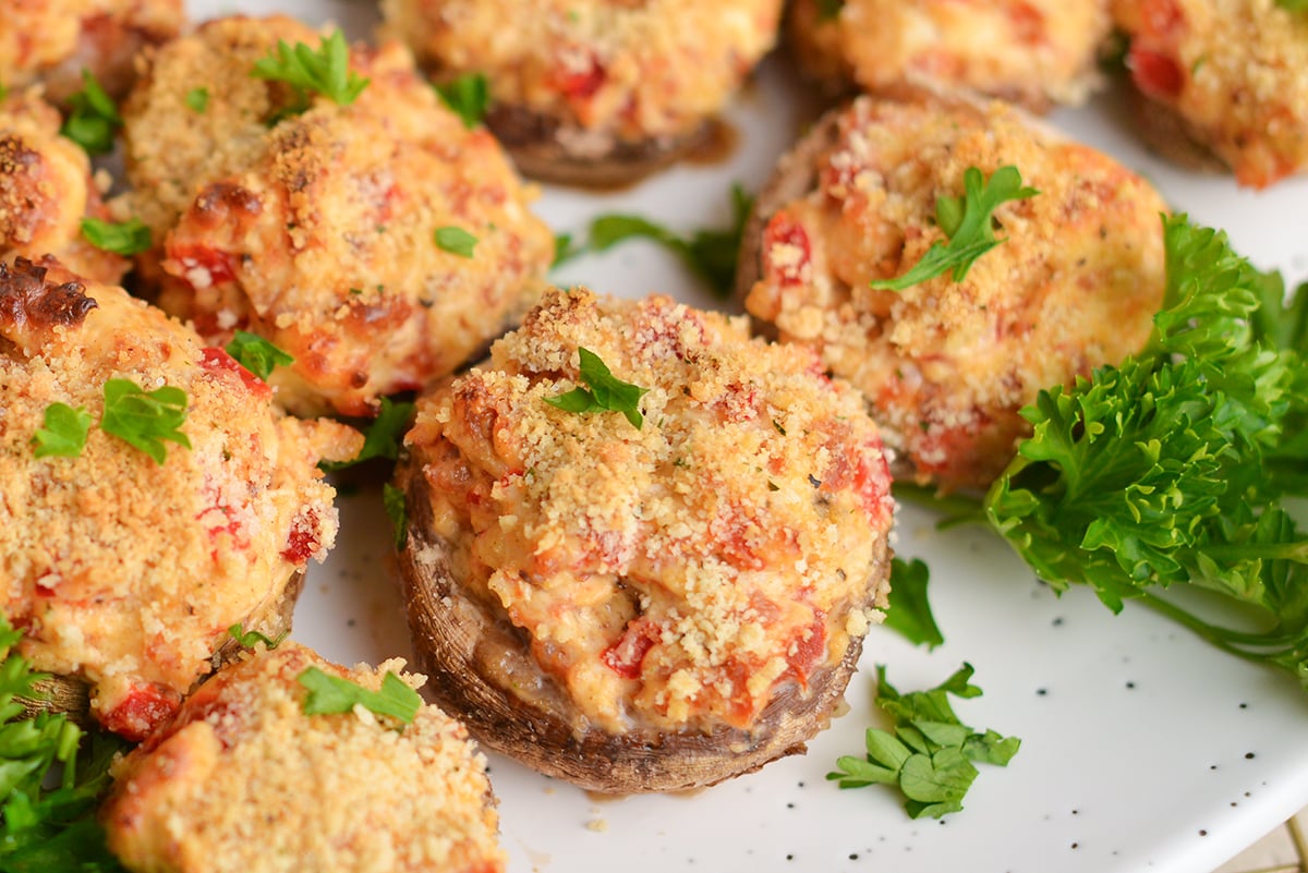 close up angled shot of creamy stuffed mushrooms