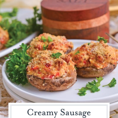 angled shot of plate of sausage stuffed mushrooms with text overlay