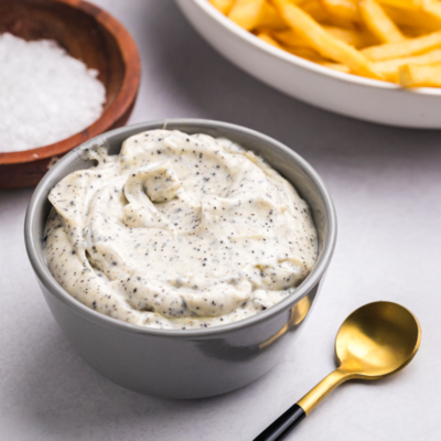 angled shot of bowl of truffle aioli