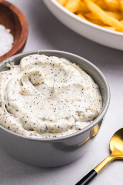 angled shot of bowl of truffle aioli