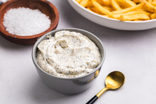 angled shot of bowl of truffle aioli
