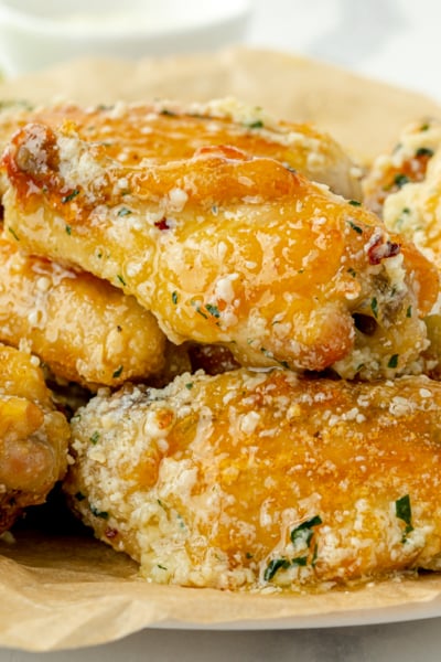 straight on shot of plate of garlic parm wings