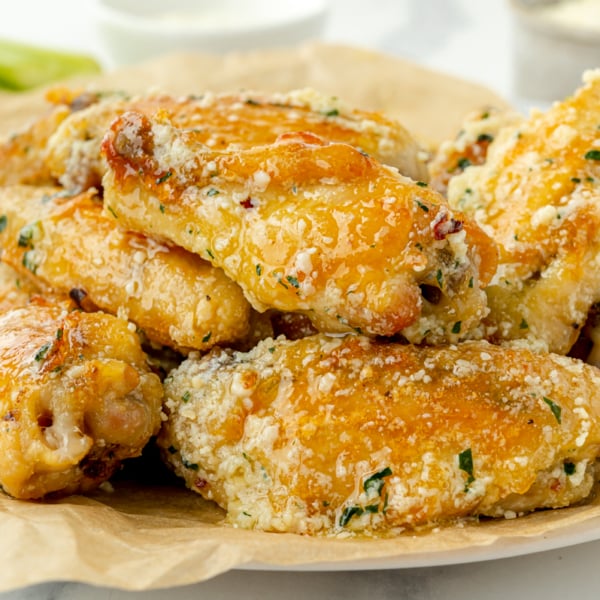 straight on shot of plate of garlic parm wings