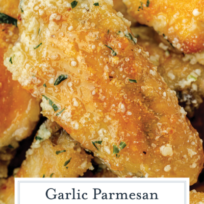close up of a baked chicken wing with butter garlic parmesan sauce