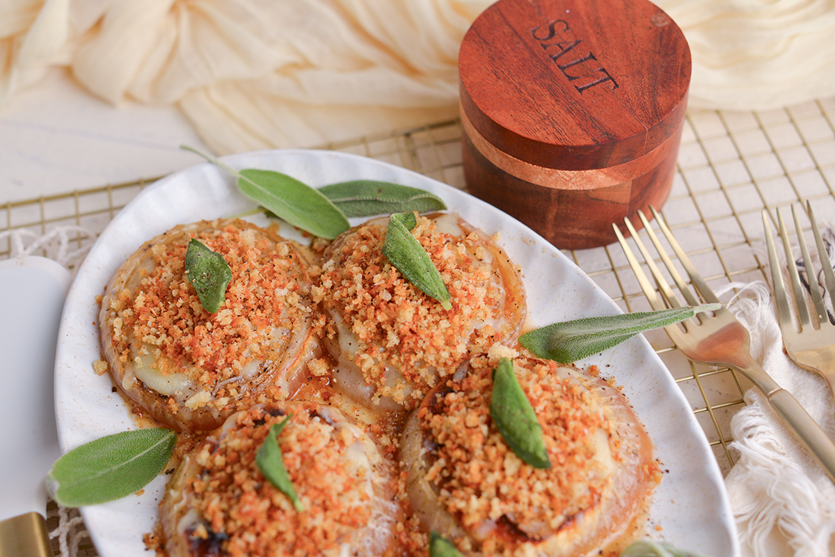angle close up of french roasted onions on a serving platter