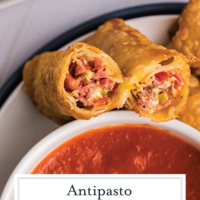 overhead shot of antipasto egg roll cut in half with text overlay