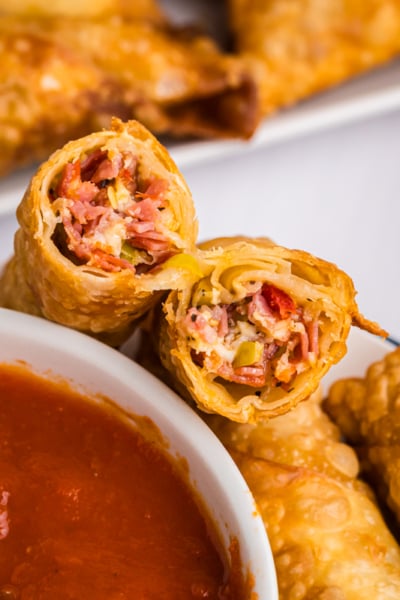 angled shot of antipasto egg roll cut in half