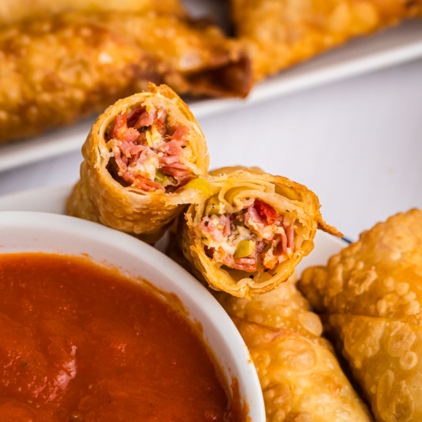 angled shot of antipasto egg roll cut in half