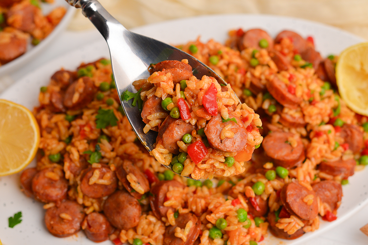 close up of chicken paella on spoon