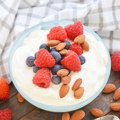 bowl of yogurt with fruit and nuts