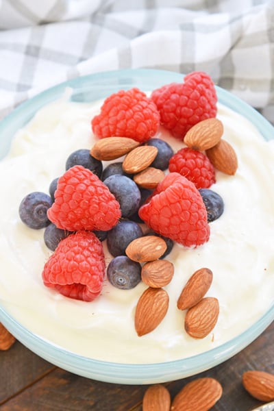 bowl of yogurt with fruit and nuts