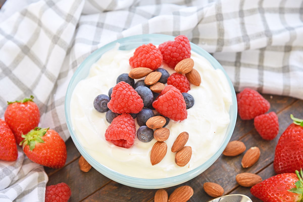 bowl of yogurt with fruit and nuts