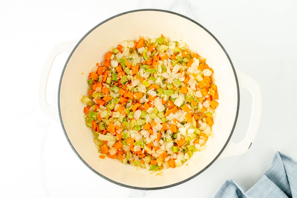 overhead shot of chopped veggies cooking in pot