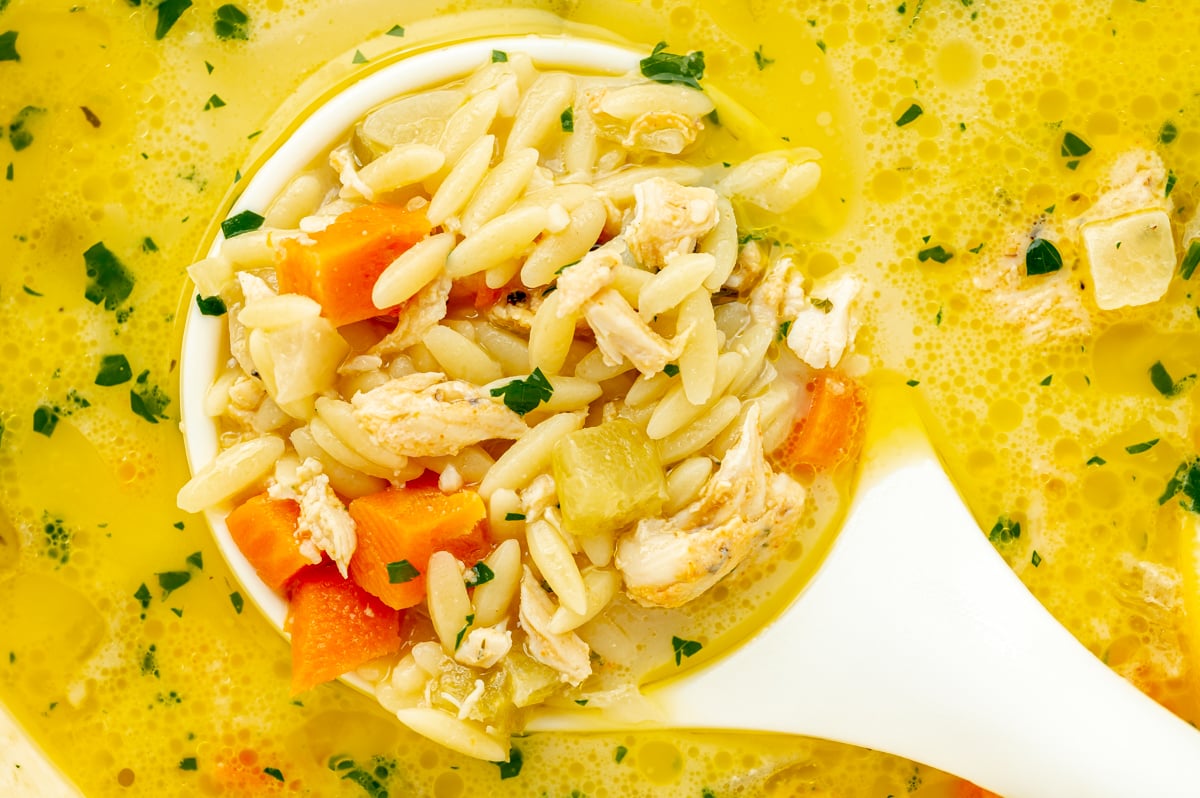 close up overhead shot of ladle full of soup