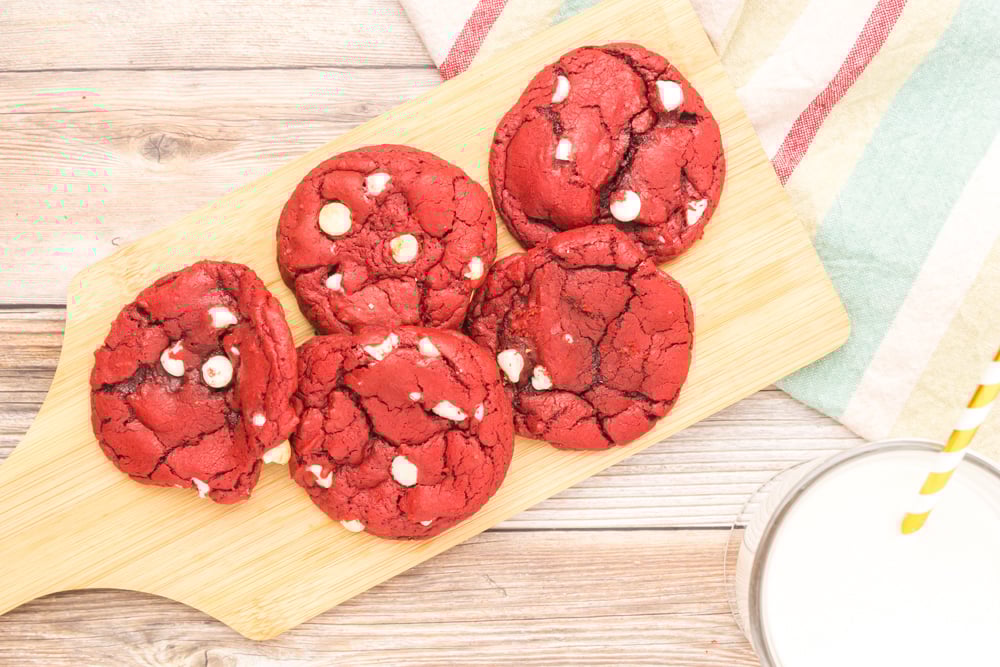 overhead shot of red velvet cookies on wooden board