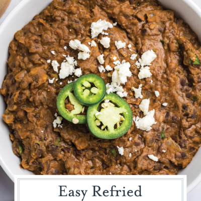 overhead shot of bowl of refried black beans with text overlay
